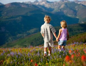 two children holding hands in the Vail mountains