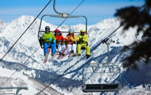 Skiers on lift to ski Vail Mountain