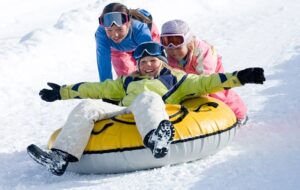 Children snow tubing in Vail