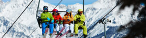 four people on a ski lift