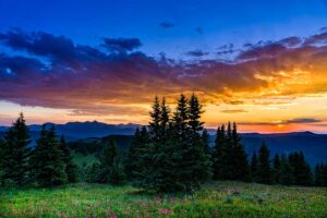 sunset with orange and blue sky Tivoli Lodge Vail Colorado