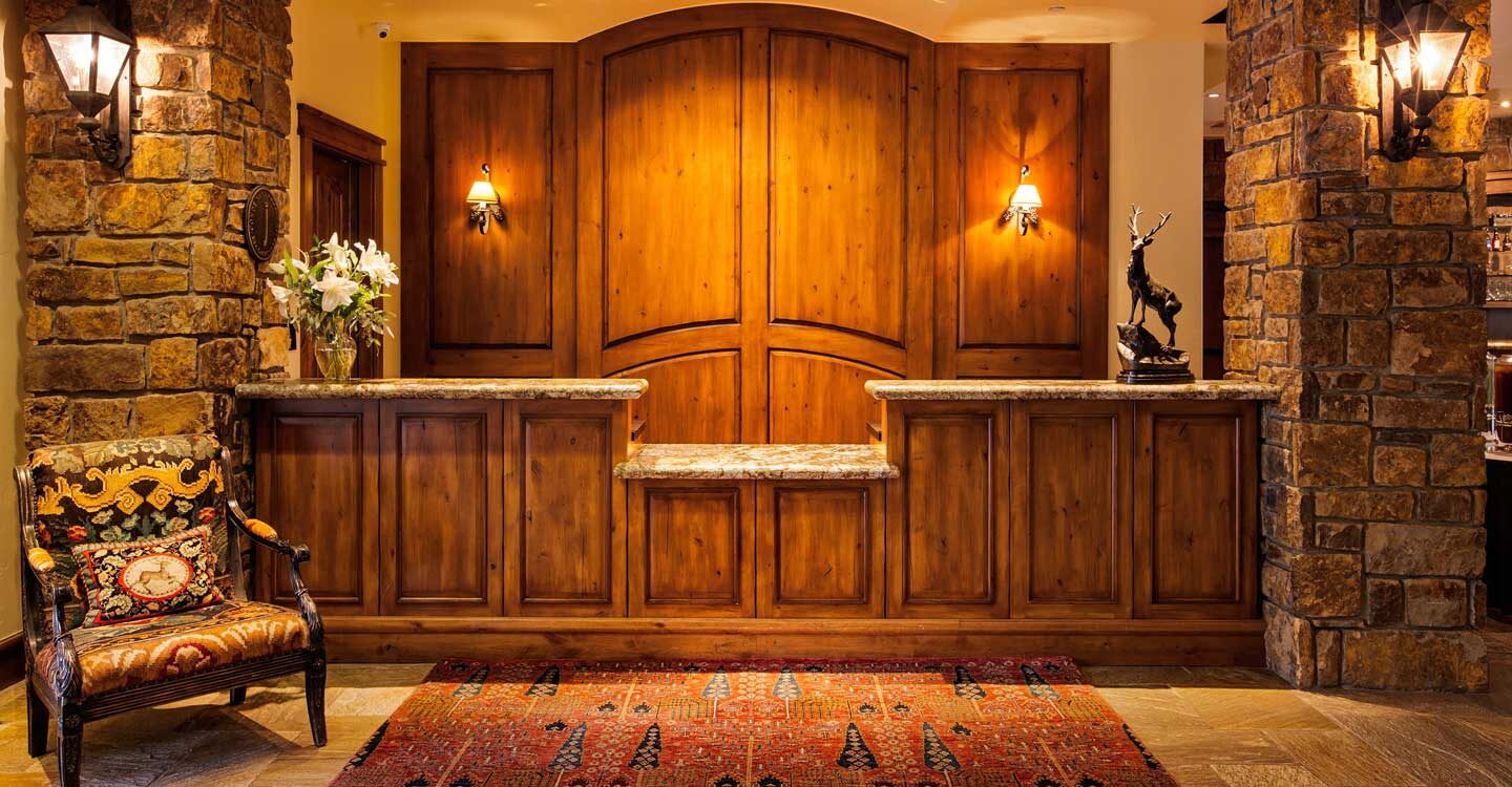 Tivoli Lodge Vail Colorado front desk reception area with wood and stone Tivoli Lodge Vail Colorado