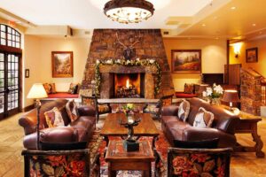 lobby of Tivoli Lodge Vail Colorado is a comfortable setting with leather couches and fireplace