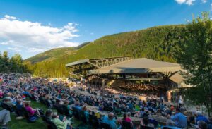 Gerald R Ford Amphitheater outdoor concert with lots of attendees Tivoli Lodge Vail Colorado
