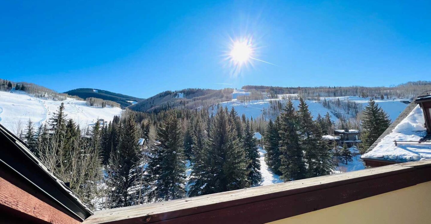 view from penthouse balcony on sunny winter day at the Tivoli Lodge Vail Colorado