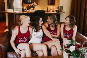 bride and bridesmaids have a laugh in the Seibert Suite at the Tivoli Lodge Vail Colorado