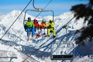 four friends take the Vail ski lift ready to hit the slopes Tivoli Lodge Vail Colorado