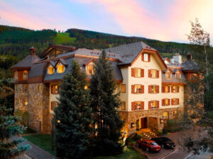 outdoor view of the Tivoli Lodge Vail Colorado at sunset during the summer