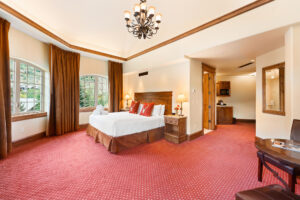spacious Tower guest rooms with desk and modern decor at the Tivoli Lodge Vail Colorado