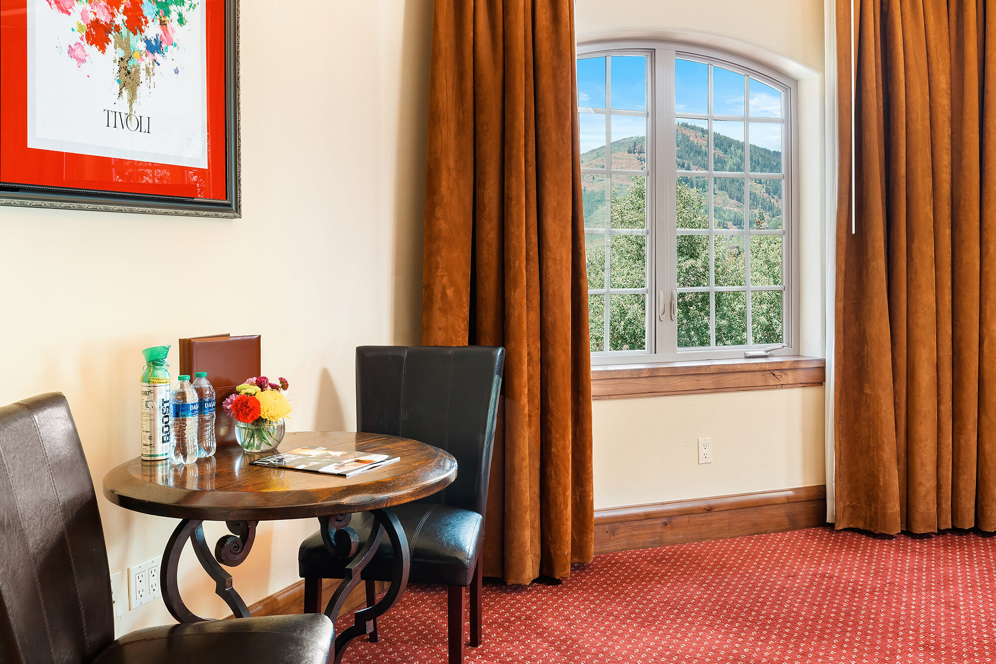 Tower village guest room has sitting area and amenities Tivoli Lodge Vail Colorado