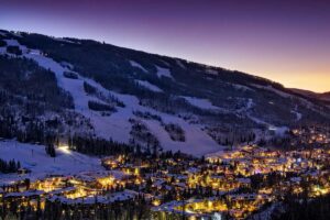 Vail lit up at sunset with view of Vail Mountain Tivoli Lodge Vail Colorado