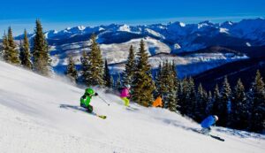 four children look like ski experts going down the mountain Tivoli Lodge Vail Colorado