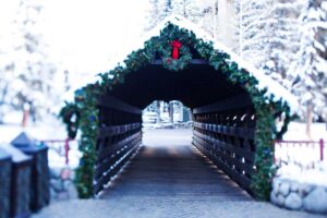 bridge is decorated with ferns and holly for the holidays Tivoli Lodge Vail Colorado