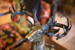 close up of bronze buck in lobby of Tivoli Lodge Vail Colorado