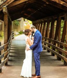 bride and groom take a moment on the Vail bridge before their wedding Tivoli Lodge Vail Colorado