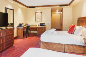 bedroom area of guest room at Tivoli Lodge Vail Colorado is ADA accessible