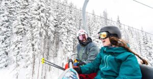couple is having a blast on the ski lift Tivoli Lodge Vail Colorado