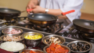 chef prepares breakfast with customized omelettes Tivoli Lodge Vail Colorado